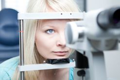 Woman having eye test